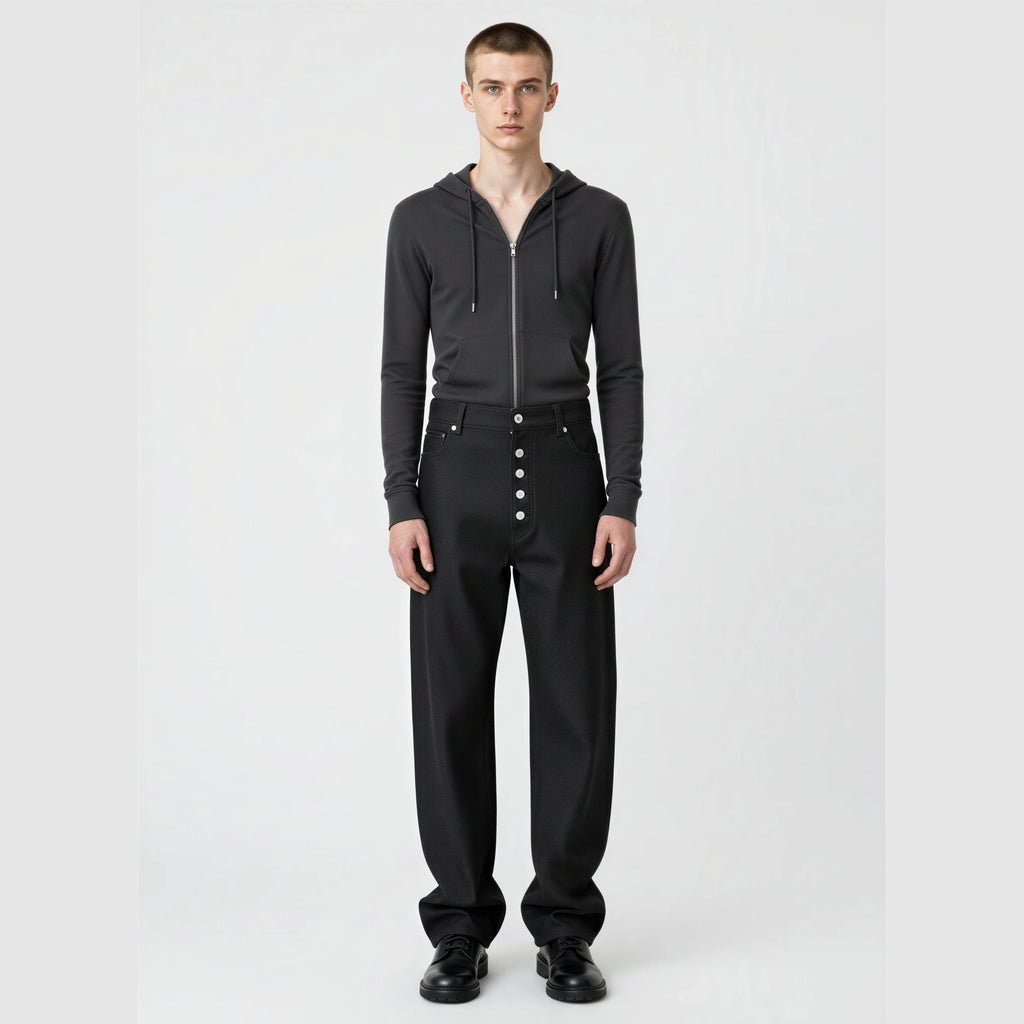 RAW BLACK DENIM straight-leg jeans on model showing mid-rise waist and silver button fly front