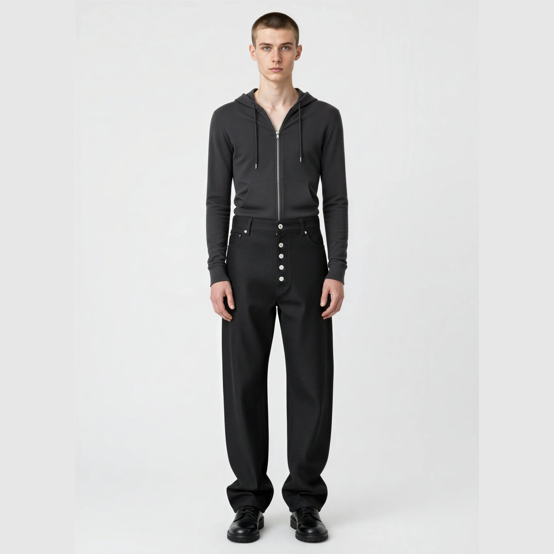 RAW BLACK DENIM straight-leg jeans on model showing mid-rise waist and silver button fly front