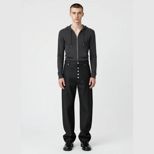 RAW BLACK DENIM straight-leg jeans on model showing mid-rise waist and silver button fly front
