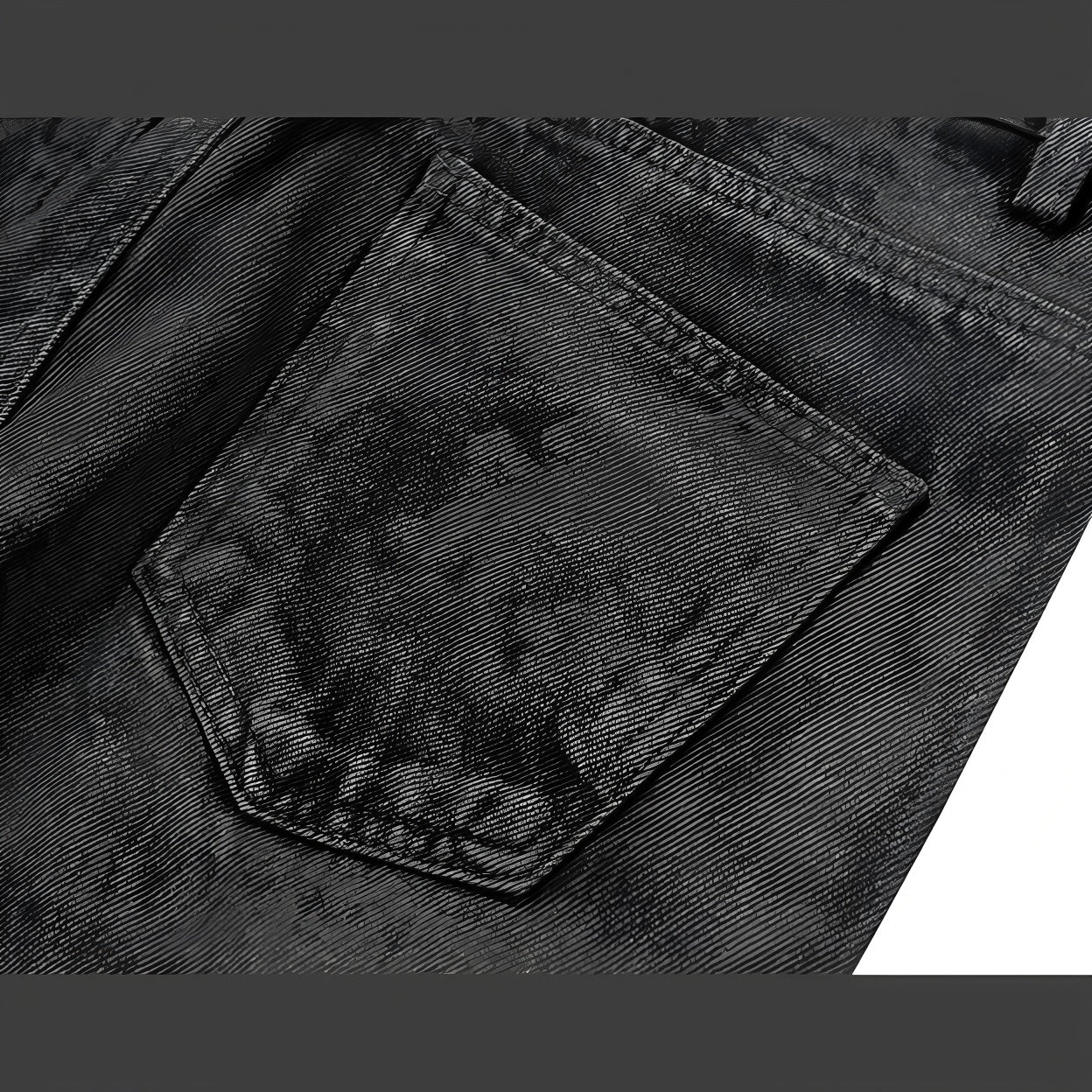 Back pocket detail on black textured camo straight-leg jeans
