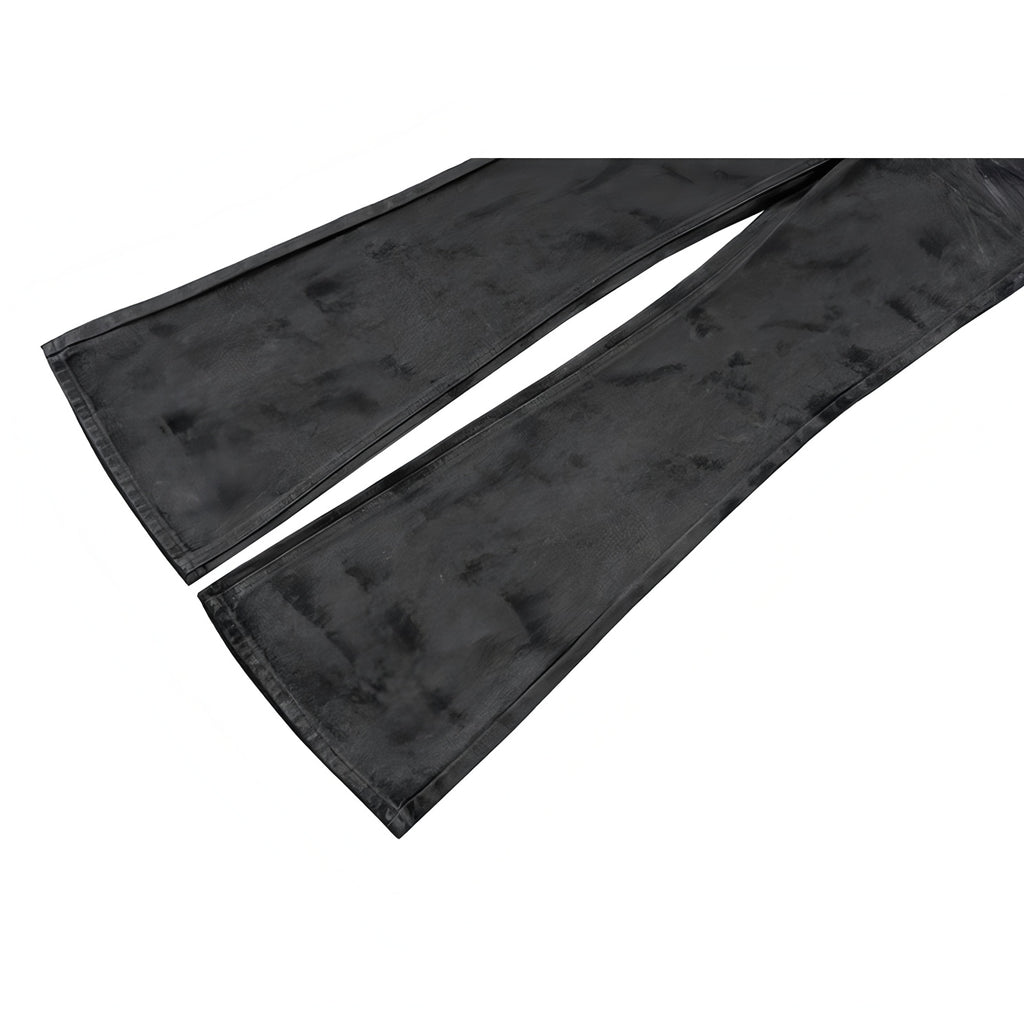 Black denim pants lower leg split hem and mottled texture detail